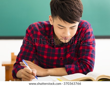 male college student study in university classroom