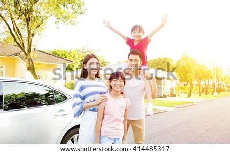 Beautiful happy family portrait  outside their  house