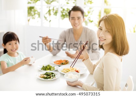 happy asian young Family enjoy their dinner