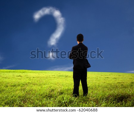 businessman thinking and watching the question mark.the  composition of the cloud