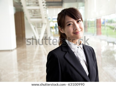young and smiling business woman Standing in front of the office