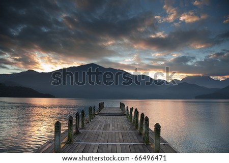 Sunrise over mountain and Looking over a pier