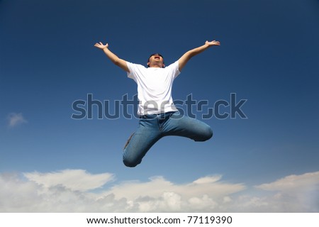 Happy man jumping with  blue sky background
