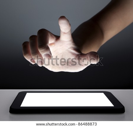 hand touching the touch screen of tablet pc hand touching the touch screen of tablet pc