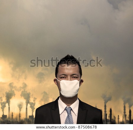 sad businessman with  mask and air pollution concept