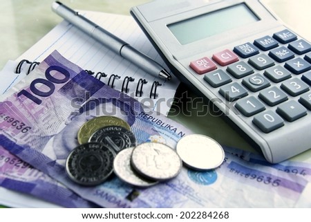 Money, calculator, notebook and pen Photo of Money, calculator, notebook and pen
