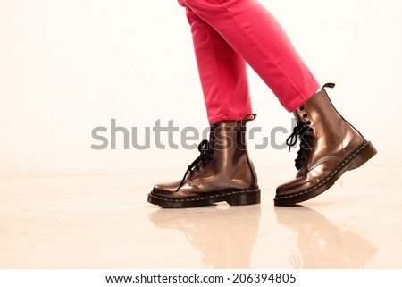 Pink Pants and leather boots Photo of a person wearing pink pants and leather boots