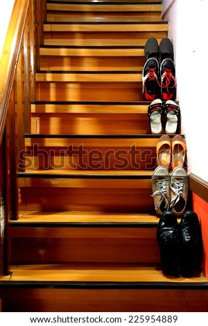Different shoes on a staircase Photo of Different shoes on a staircase