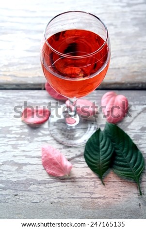 Colorful Drink in a goblet Photo of a Colorful Drink in a goblet on a wooden table