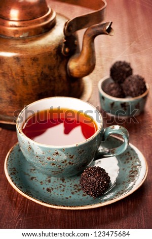 Tea and chocolate candies in a vintage style