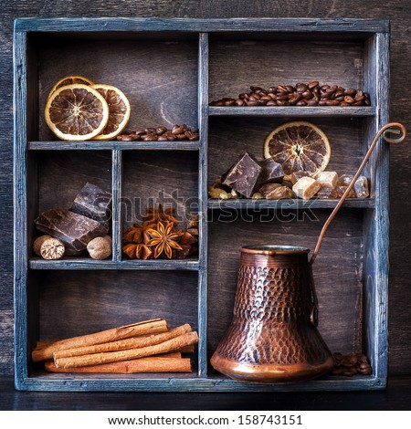 Spices, coffee and chocolate in a vintage wooden box