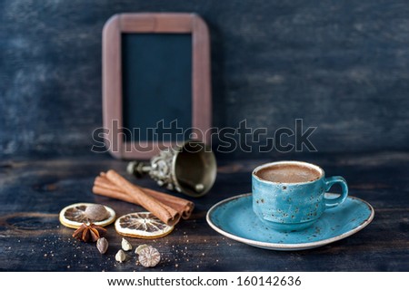 Espresso coffee and spices on a vintage wooden background with the chalk board menu