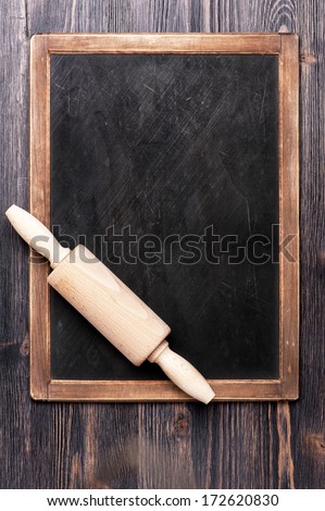 Menu slate chalk board with a rolling pin