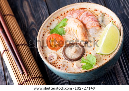 Spicy Thai Tom Yam soup with coconut milk. Sea Food Thai.