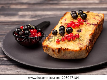 Cake with berries red currant and black currant