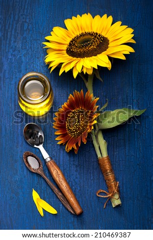 Sunflower oil and sunflower flowers