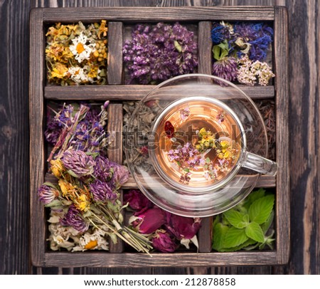 Dried Herbs and flowers  in vintage box and and herbal tea
