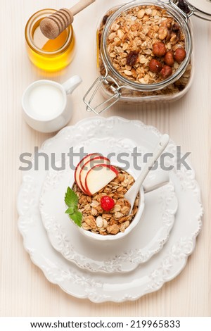 Granola muesli with honey and milk. Healthy breakfast.