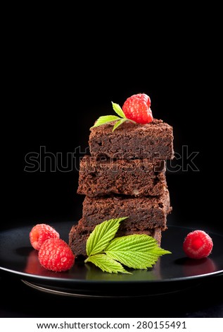 Chocolate cake brownies with raspberries