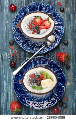 Chia seeds coconut pudding with berries and fruit. super  food. top view
