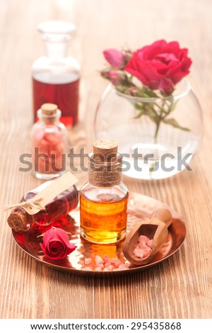 Rose essential oil, sea salt and flowers roses. Spa, body care, aromatherapy.