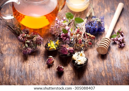 Herbal tea with honey, herbs and flowers, herbal medicine.
