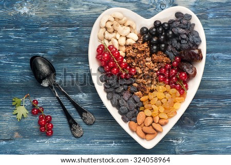 berries, nuts, granola, dried fruits. Super food for healthy breakfast. Top view