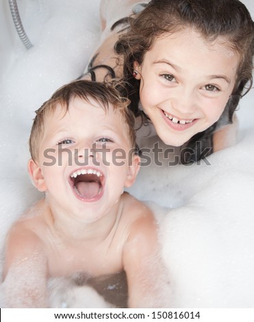 Brother And Sister Taking A Bubble Bath