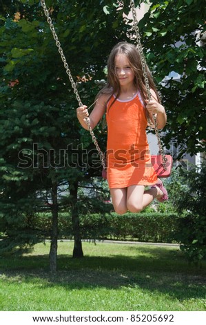 stock-photo-cute-girl-playing-on-the-playground-85205692.jpg