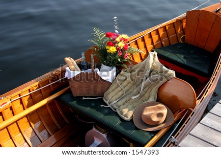 Antique wooden boat with period clothing
