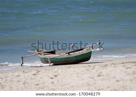 A fisherman\'s boat or dhow or indigenous canoe in Northern Mozambique city of Pemba.