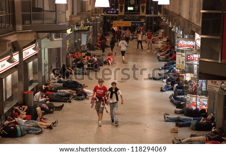 MUNICH, GERMANY - MAY 20: FC Bayern Muenchen supporters sleep at Munic train station after UEFA Champions League Final between FC Bayern Muenchen and Chelsea FC on May 20, 2012 in Munich, Germany