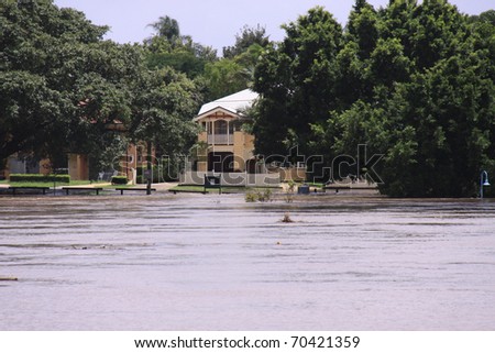 BRISBANE, QUEENSLAND/AUSTRALIA - JANUARY 13: Flooded street with look on the Brisbane river on January 13, 2011 in Toowong, Brisbane, Queensland, Australia.
