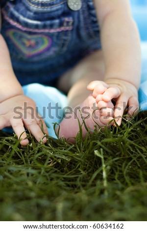Baby Hands and Feet in the Grass