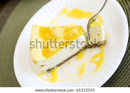 Swirled Mango Cheesecake Being Eaten with a Fork