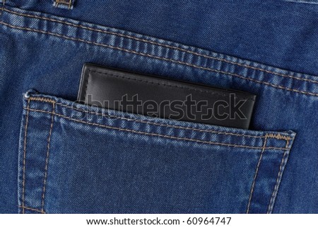 black wallet in a jeans pocket