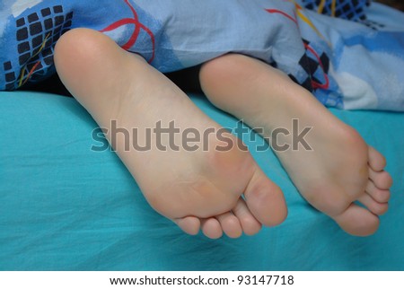 Female feet in bed