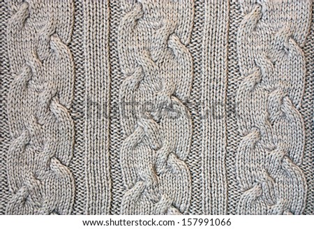 Knitted cloth is made by hand. It is decorated with bulging pattern.