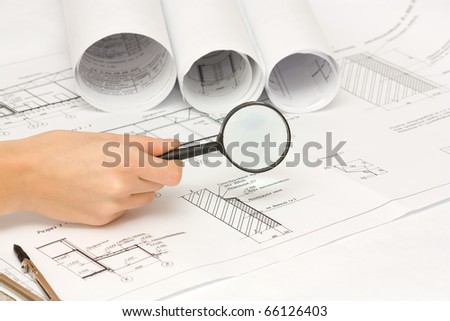 Architect working on architectural plans