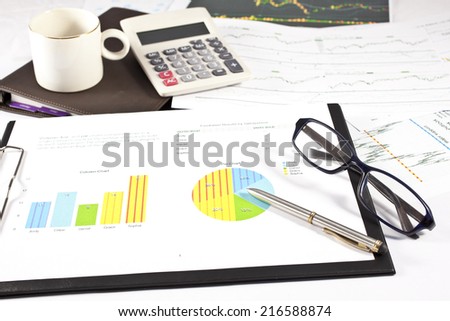 Businessman working on the calculator and his laptop to analyze the investment charts, Accounting and financial concept
