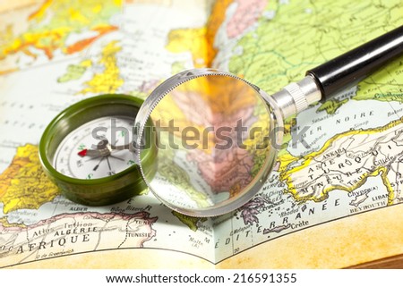 Magnetic compass old map conceptual of global travel , tourism and exploration