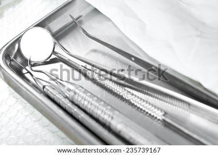 Metallic dentist tools close up in a dentist clinic.