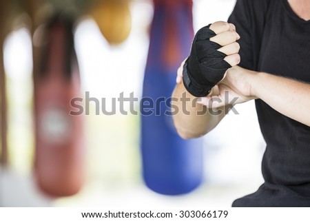 female boxer preparing for thai boxing