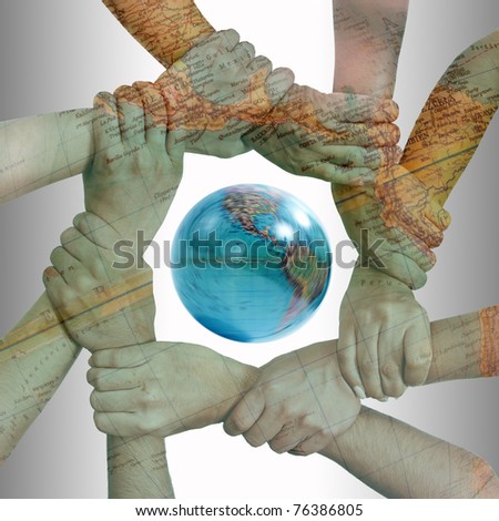 Small group of business people joining hands, bird\'s eyes angle view with globe.