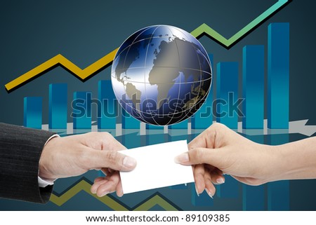 business hand holding a globe with increasing graph