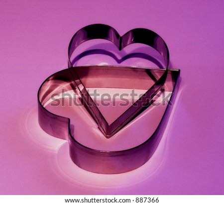 heart shapes (pastry cutters) with a  purple hue