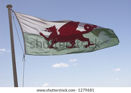 Welsh flag flying in a sunny sky