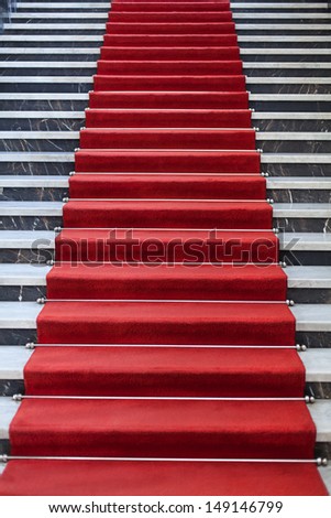 Marble Stairs covered with red carpet