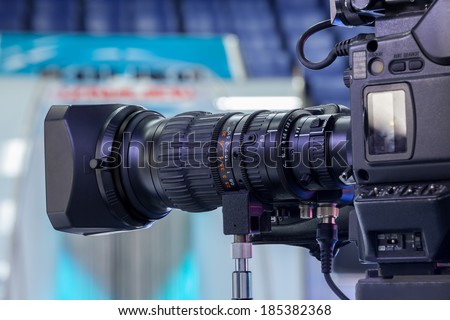 Video camera lens - recording show in TV studio - focus on camera aperture