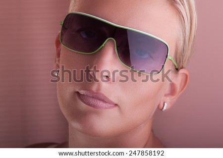 Middle age attractive woman fashion portrait head shot with sunglasses